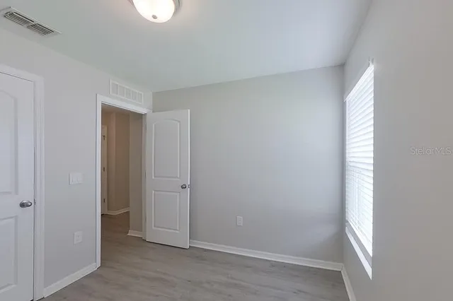 a view of an empty room and window