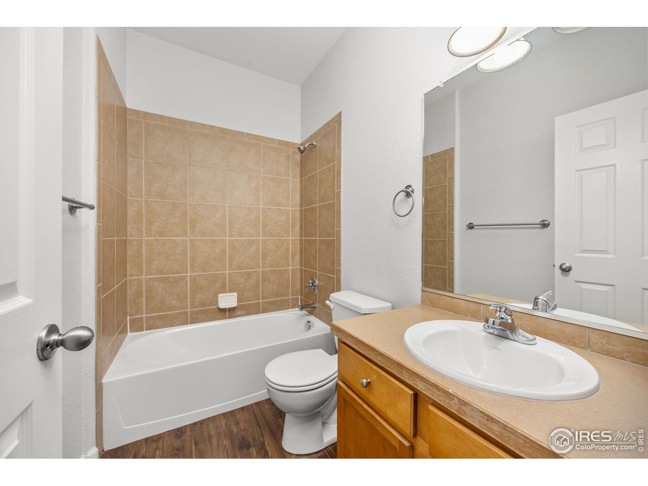 1900 68th Avenue, Unit 810 Greeley, CO 80634 - Photo 20 of 24 a bathroom with a sink a toilet and shower