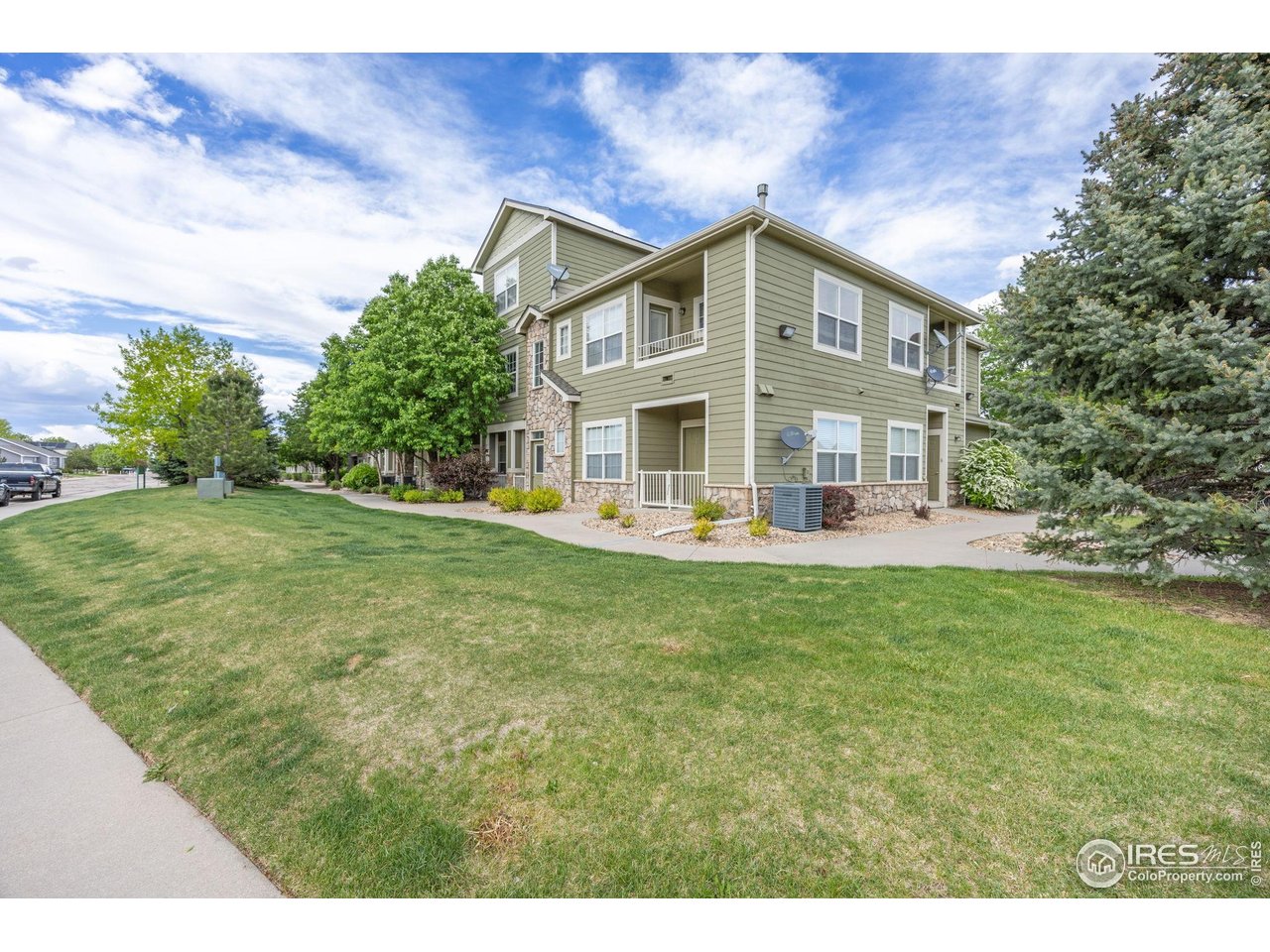 1900 68th Avenue, Unit 810 Greeley, CO 80634 - Photo 23 of 24 a view of a house with a yard
