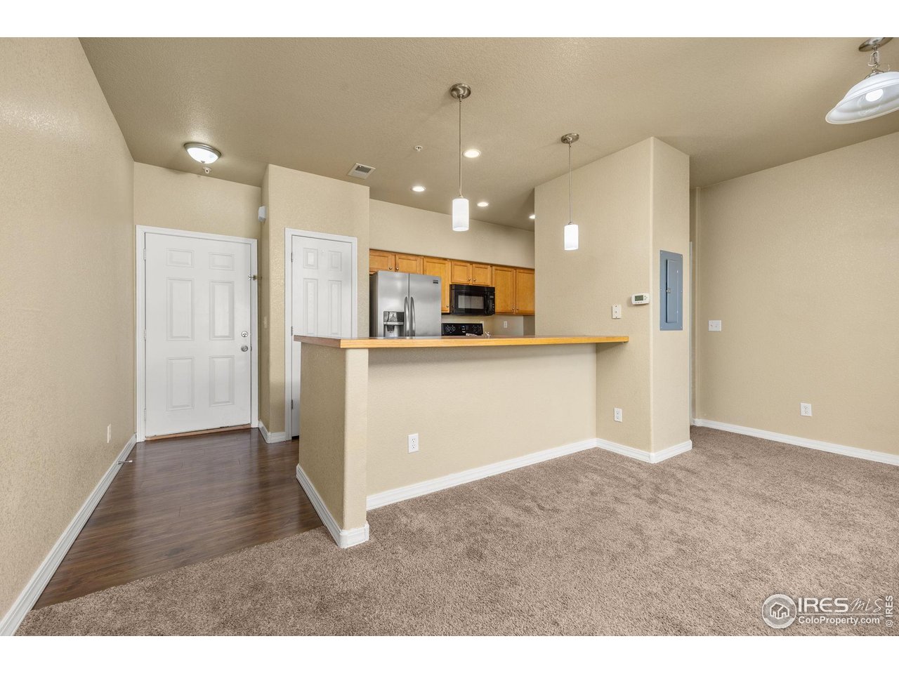 1900 68th Avenue, Unit 810 Greeley, CO 80634 - Photo 5 of 24 a view of kitchen with stainless steel appliances granite countertop a refrigerator a sink and a stove