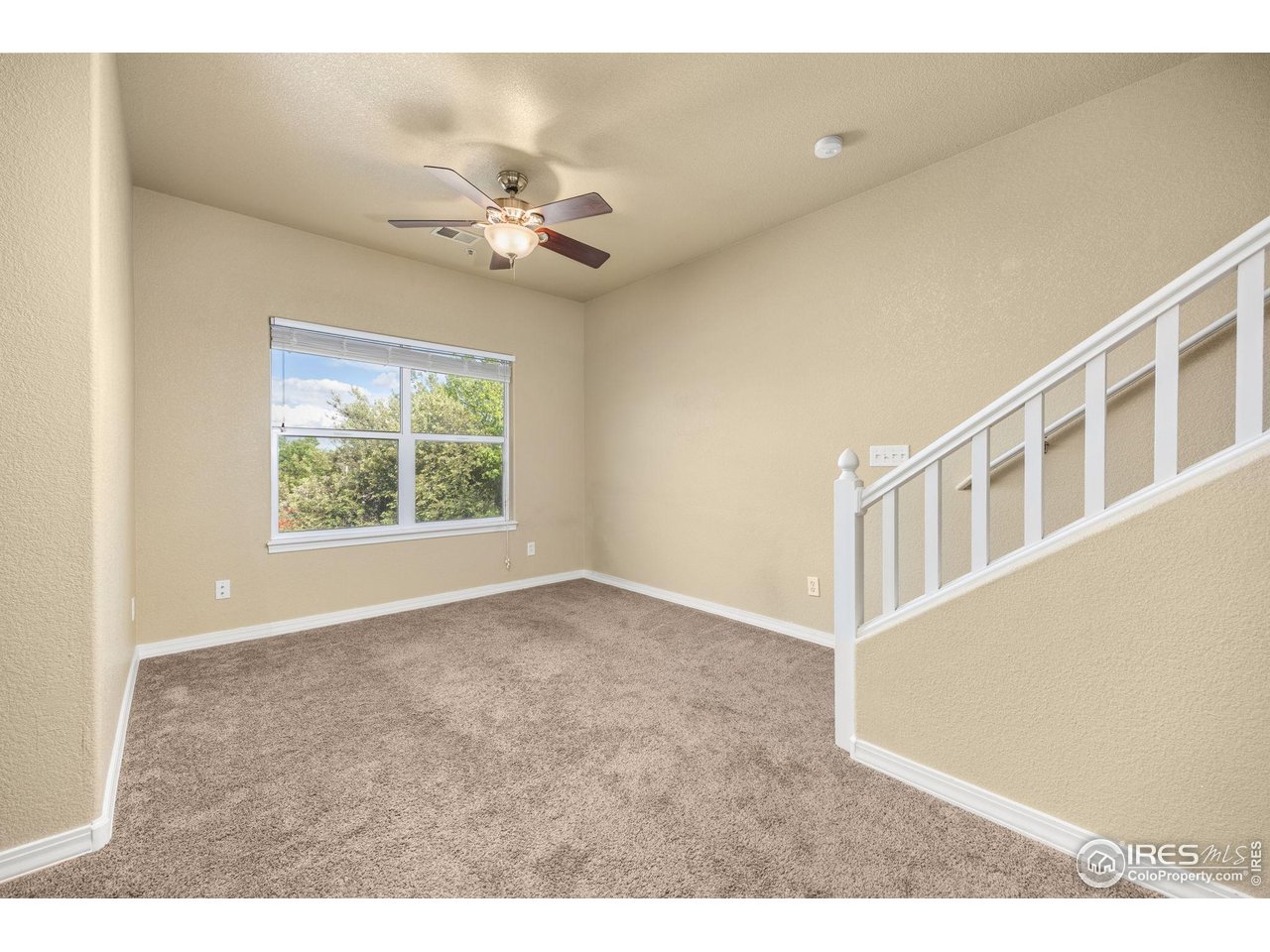1900 68th Avenue, Unit 810 Greeley, CO 80634 - Photo 7 of 24 a view of an empty room with a window