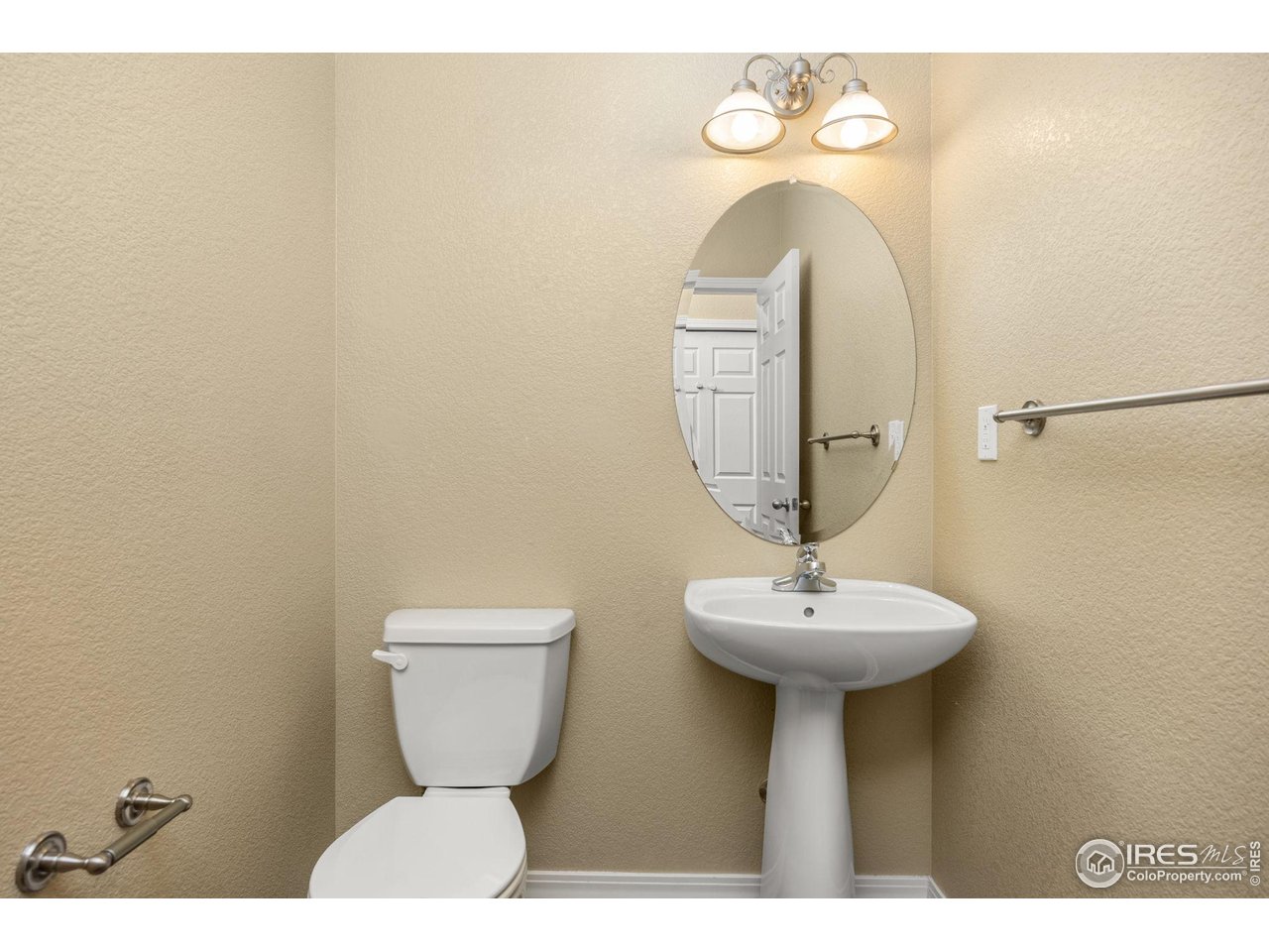 1900 68th Avenue, Unit 810 Greeley, CO 80634 - Photo 9 of 24 a bathroom with a sink and a mirror