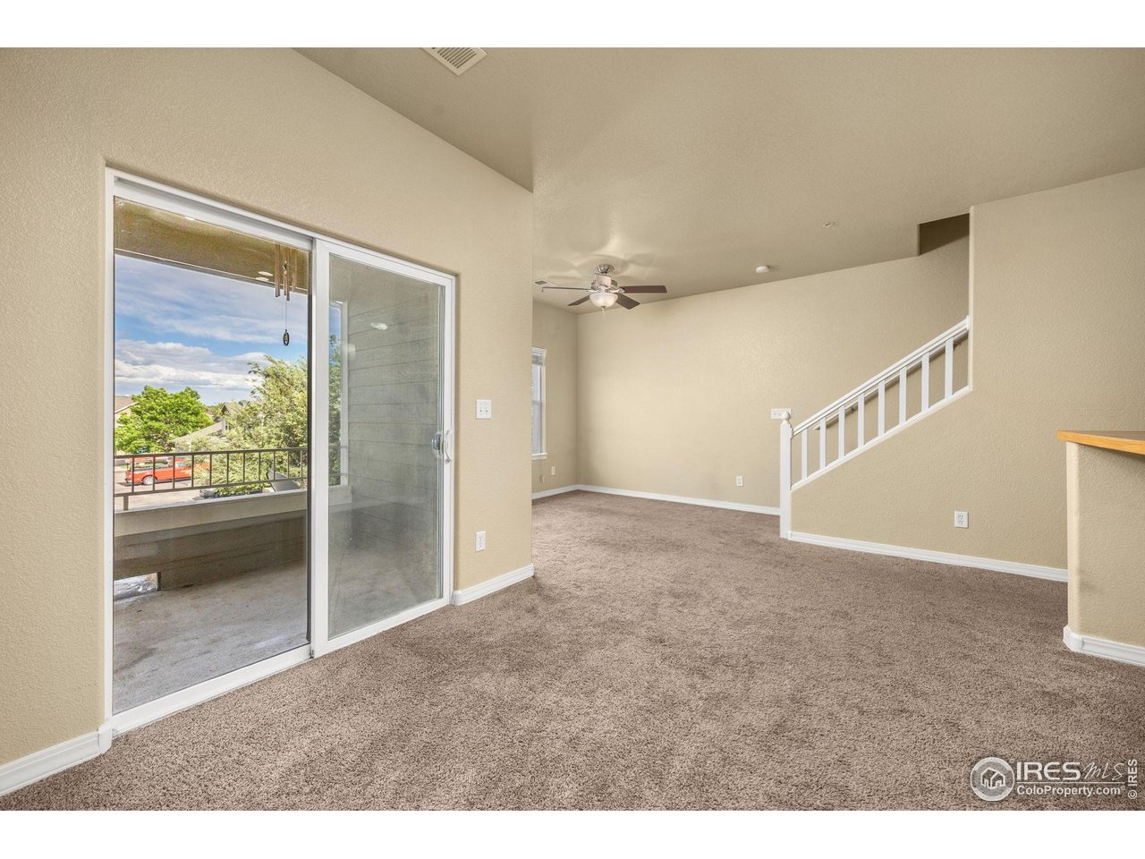 1900 68th Avenue, Unit 810 Greeley, CO 80634 - Photo 10 of 24 a view of an empty room with a window