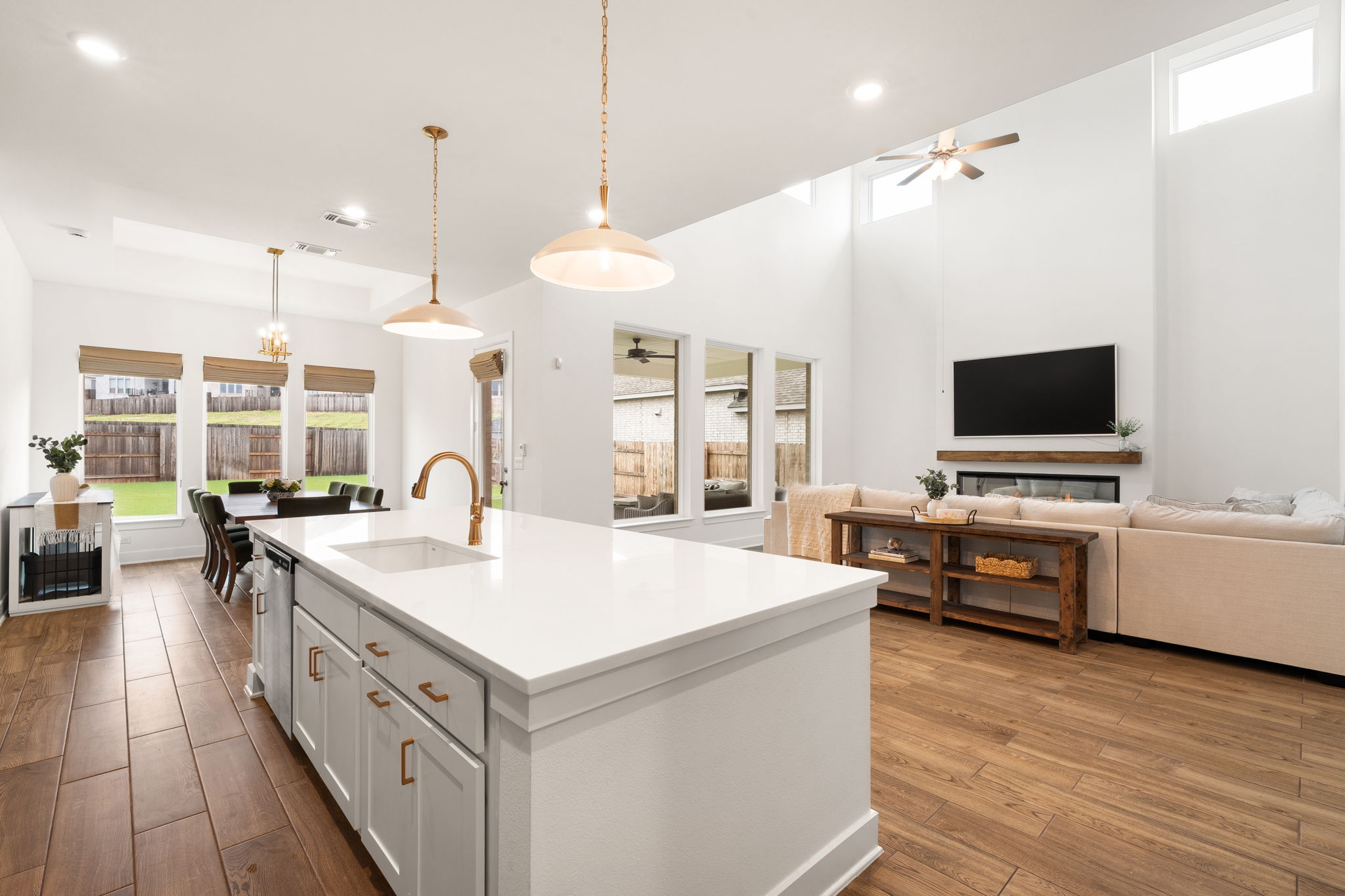 515 Watershield Cove Georgetown, TX 78633 - Photo 15 of 40 An open concept living space featuring a central kitchen island and soaring ceilings.