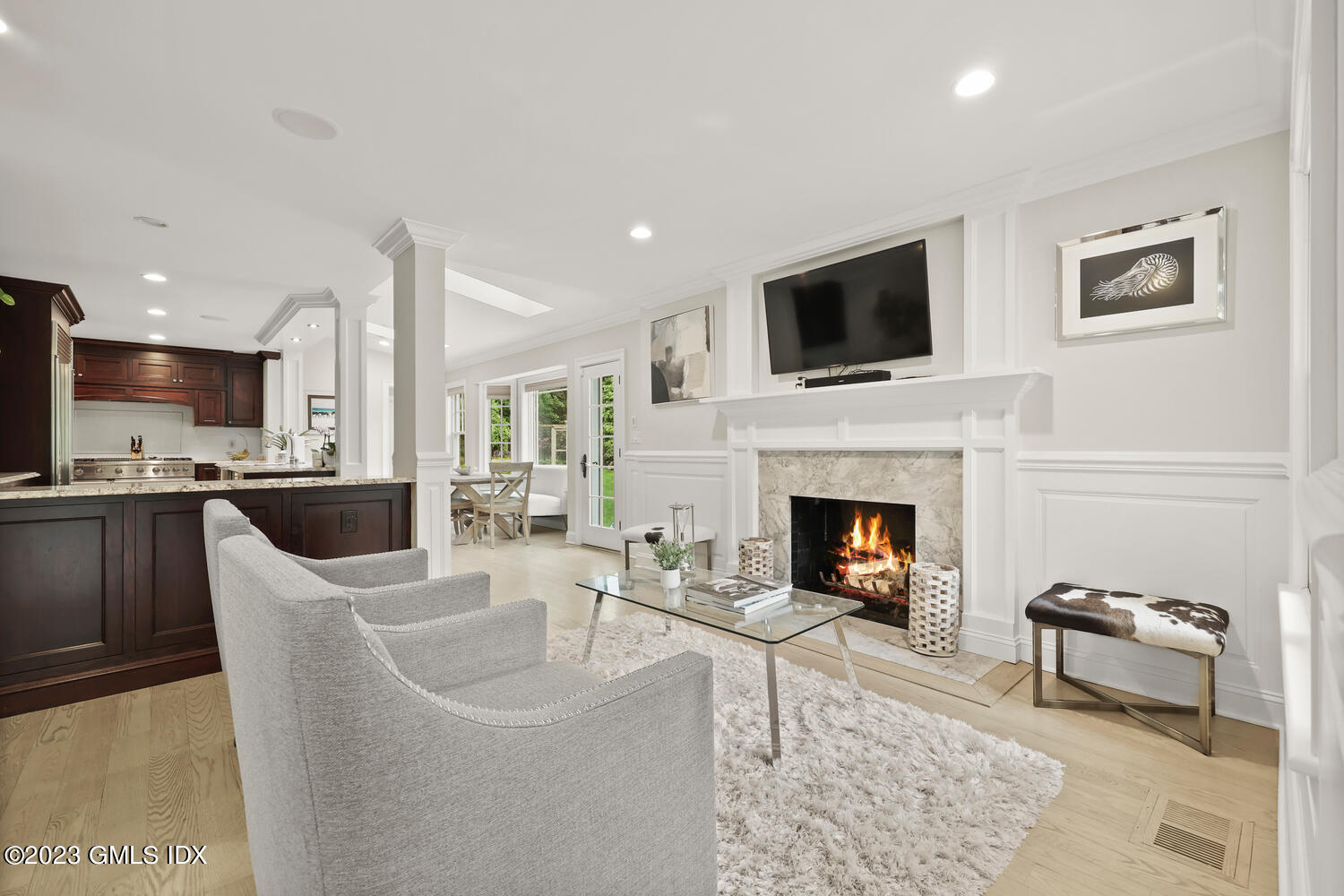 26 Twin Lakes Lane Riverside, CT 06878 - Photo 11 of 38 a living room with furniture a fireplace and television