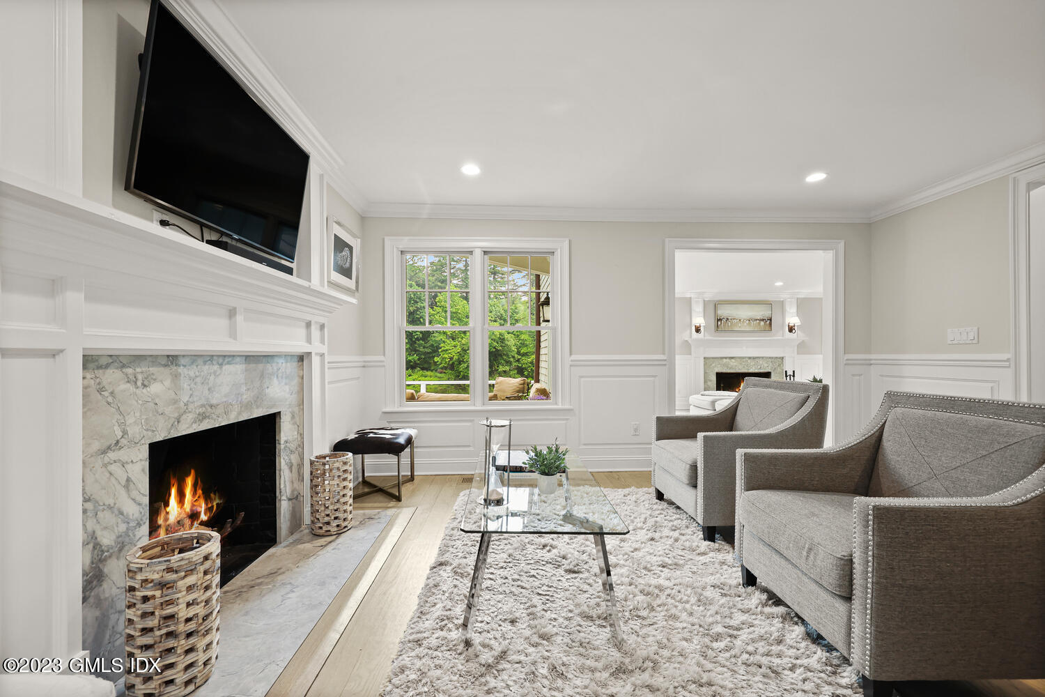 26 Twin Lakes Lane Riverside, CT 06878 - Photo 12 of 38 a living room with furniture a flat screen tv and a fireplace