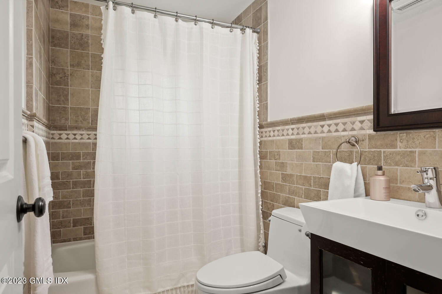 26 Twin Lakes Lane Riverside, CT 06878 - Photo 20 of 38 a bathroom with a sink toilet and shower