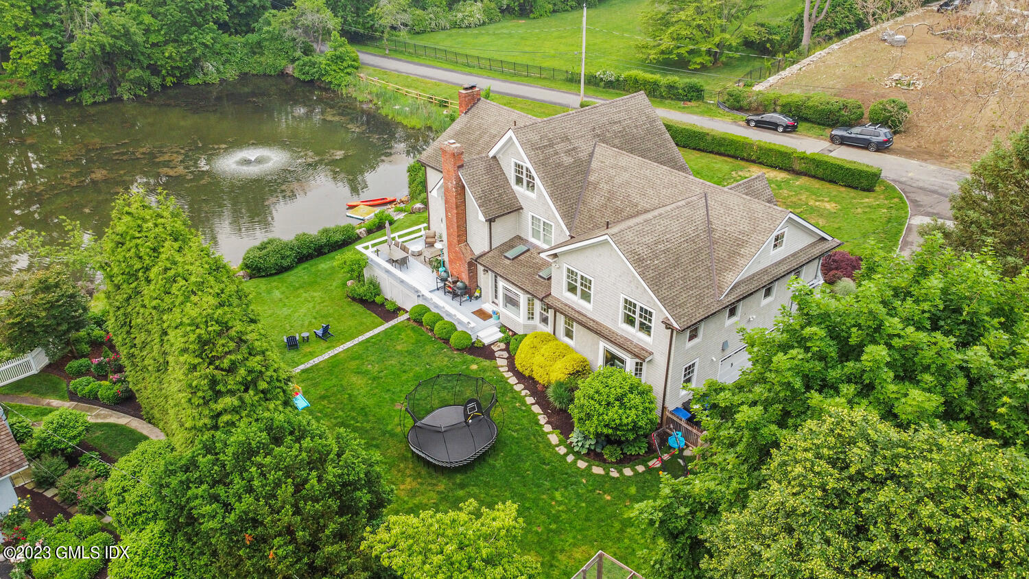 26 Twin Lakes Lane Riverside, CT 06878 - Photo 3 of 38 an aerial view of a house with swimming pool and garden