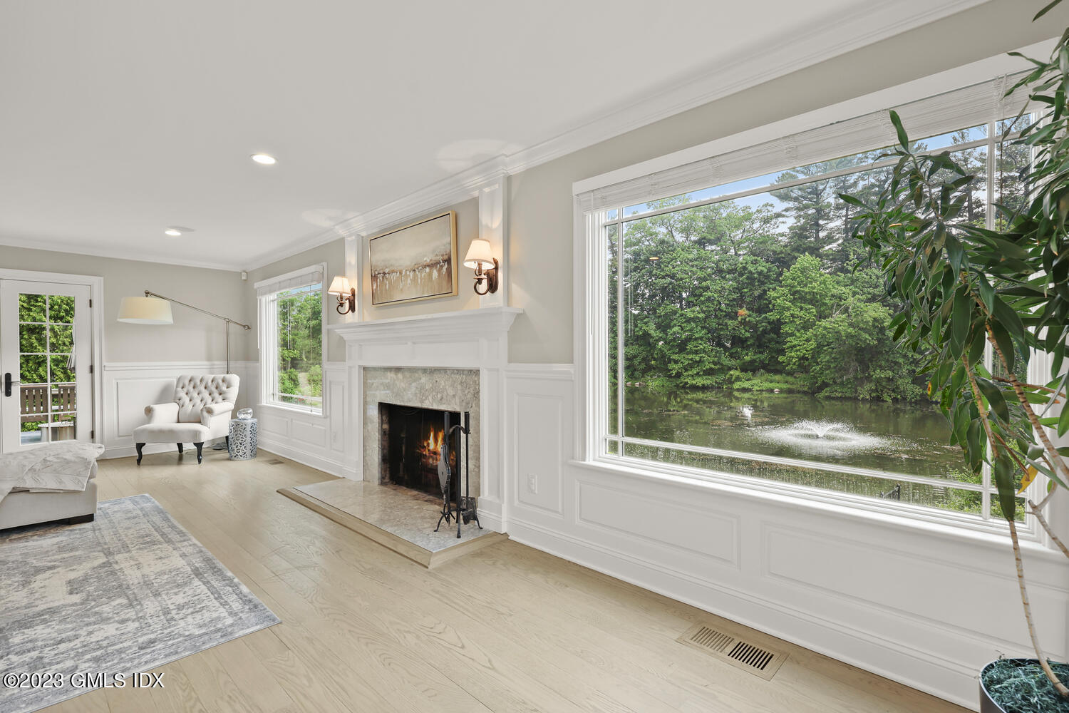 26 Twin Lakes Lane Riverside, CT 06878 - Photo 37 of 38 a view of a livingroom with furniture and a fireplace