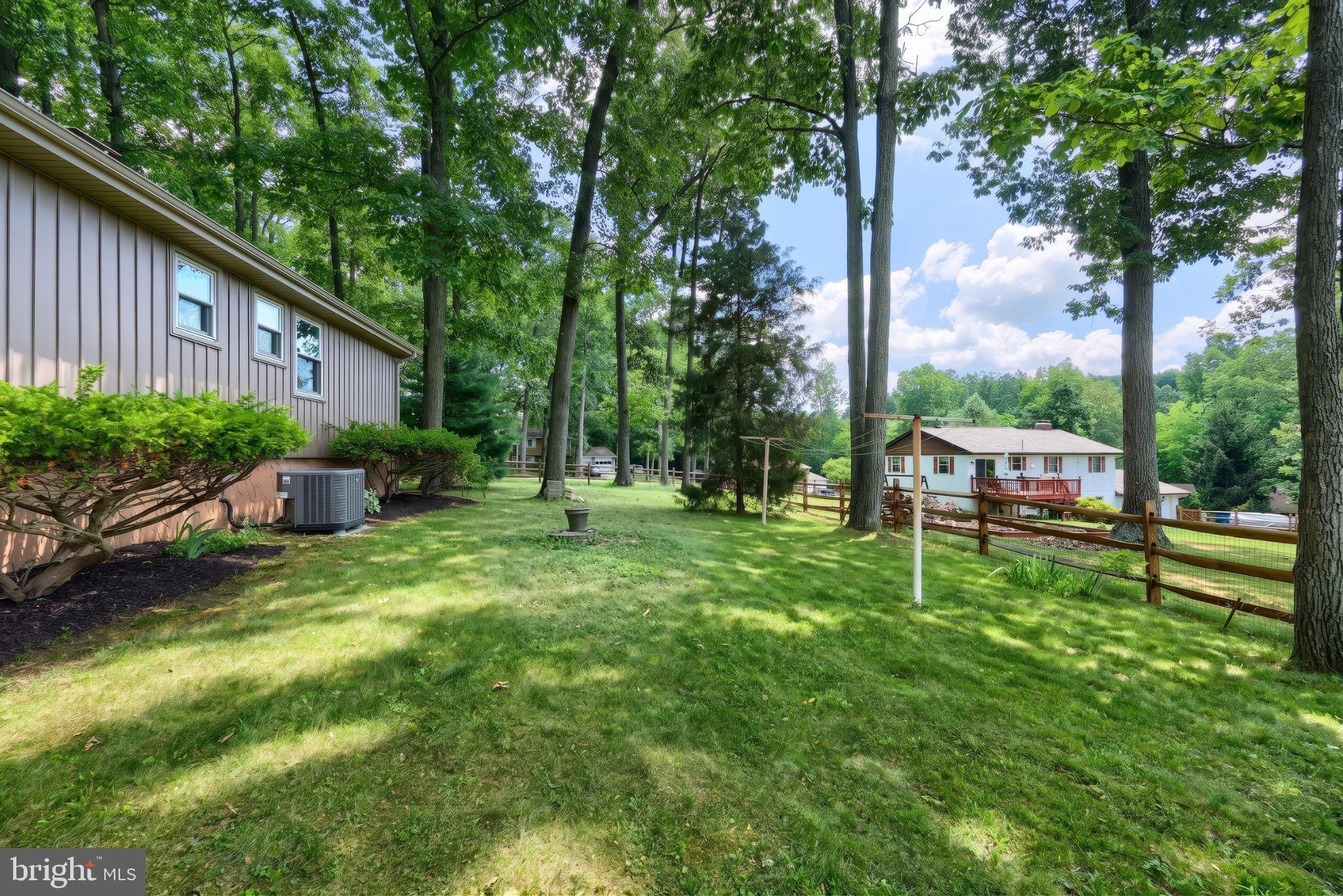 468 Fairview Drive Hanover, PA 17331 - Photo 14 of 42 Serene backyard oasis in lush greenery.