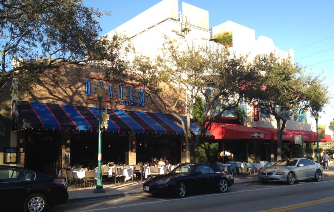 408 Southwest 4th Street Delray Beach, FL 33444 - Photo 29 of 31 a couple of cars parked in front of a building