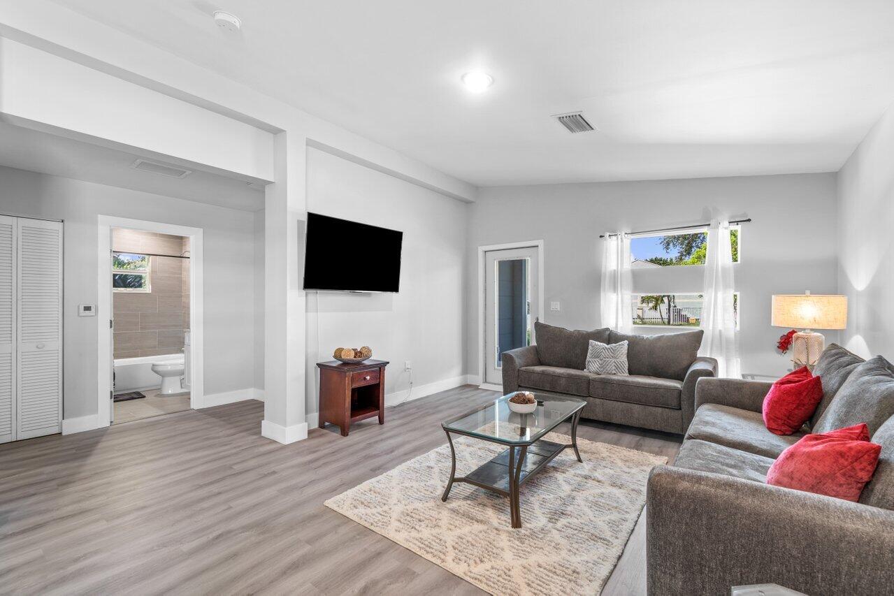 408 Southwest 4th Street Delray Beach, FL 33444 - Photo 8 of 31 a living room with furniture and a flat screen tv