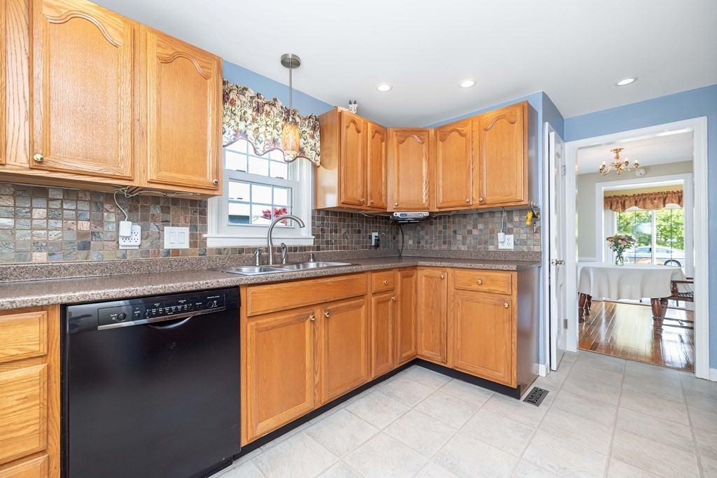 18 Redstone Drive Springfield, MA 01118 - Photo 13 of 31 a kitchen with stainless steel appliances granite countertop sink stove and granite counter top
