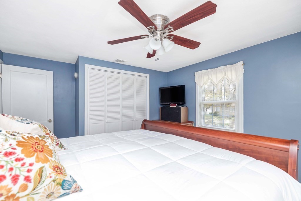 18 Redstone Drive Springfield, MA 01118 - Photo 18 of 31 a bedroom with a large bed and a window