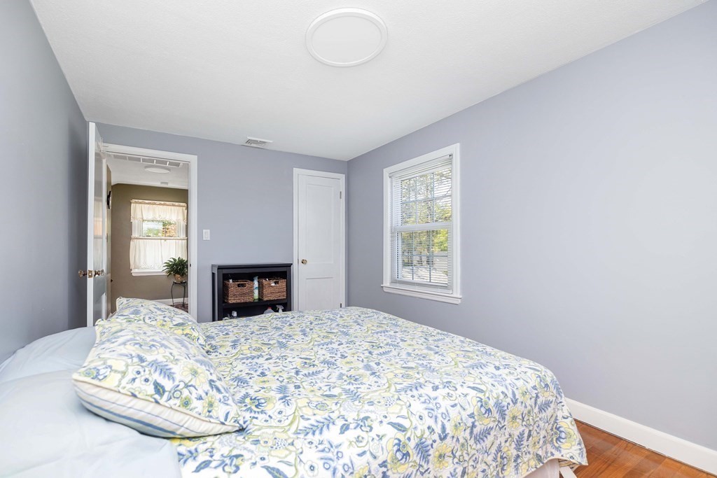 18 Redstone Drive Springfield, MA 01118 - Photo 19 of 31 a bedroom with a large bed and a dresser