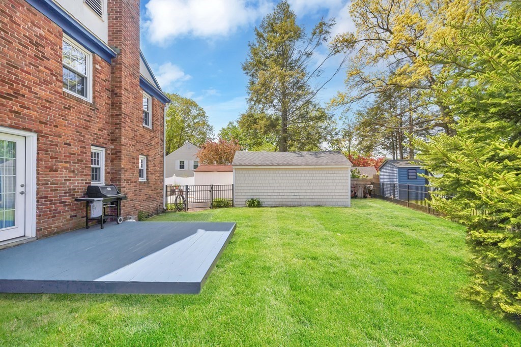18 Redstone Drive Springfield, MA 01118 - Photo 2 of 31 a view of a backyard with table and chairs and potted plants