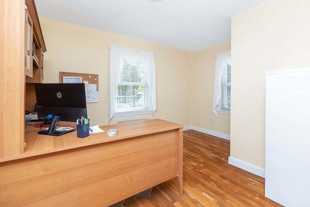 18 Redstone Drive Springfield, MA 01118 - Photo 21 of 31 a room with wooden floor and furniture