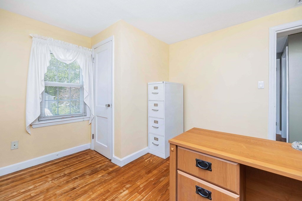 18 Redstone Drive Springfield, MA 01118 - Photo 22 of 31 a view of storage and utility room with wooden floor