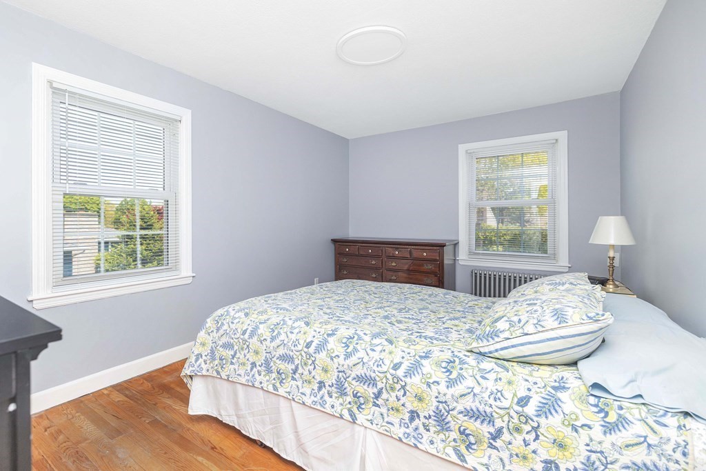 18 Redstone Drive Springfield, MA 01118 - Photo 23 of 31 a bedroom with a bed and wooden floor