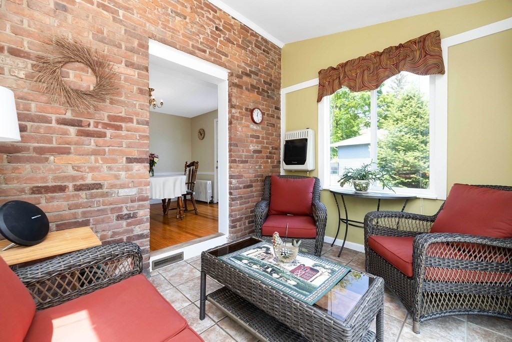 18 Redstone Drive Springfield, MA 01118 - Photo 24 of 31 a living room with furniture and a floor to ceiling window