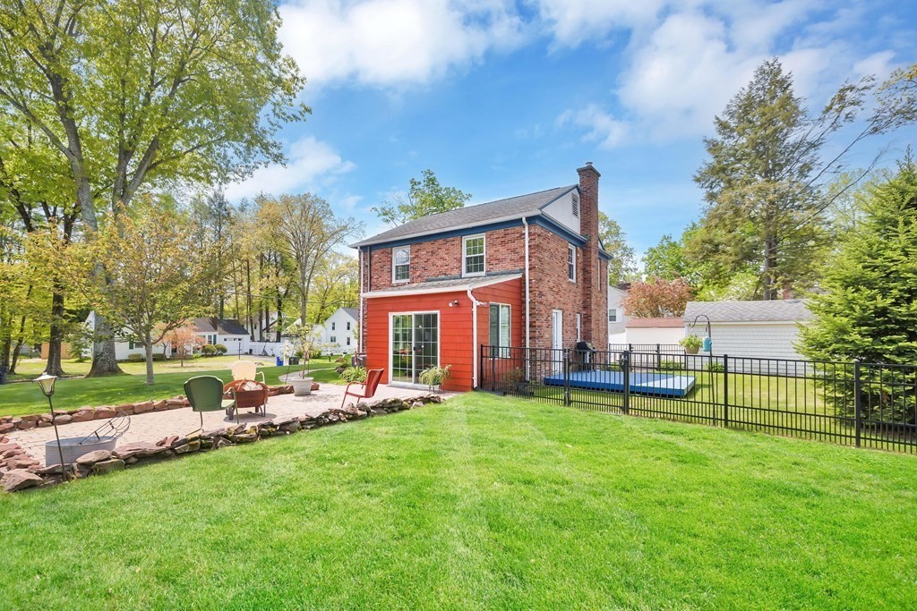 18 Redstone Drive Springfield, MA 01118 - Photo 25 of 31 a view of a house with a yard and sitting area