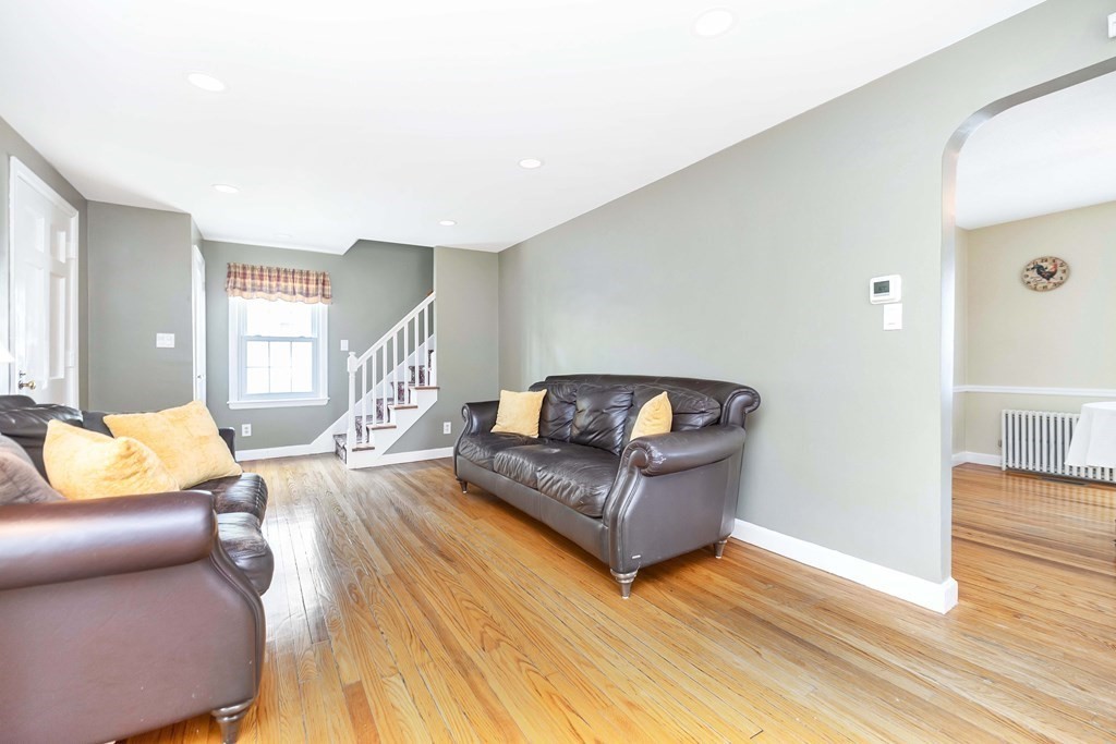 18 Redstone Drive Springfield, MA 01118 - Photo 5 of 31 a living room with furniture and a wooden floor