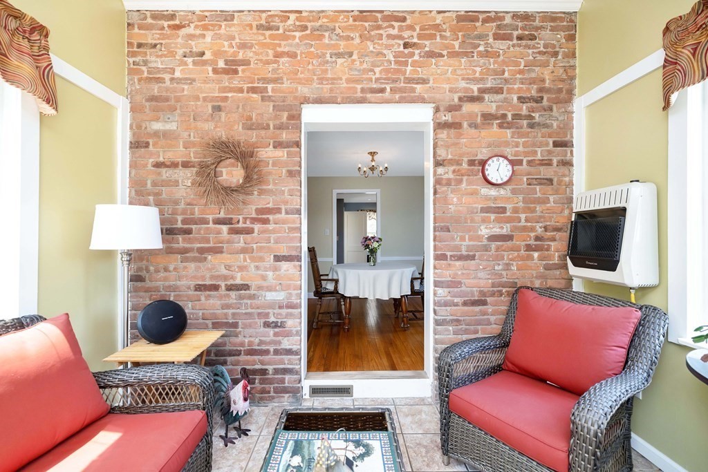 18 Redstone Drive Springfield, MA 01118 - Photo 9 of 31 a living room with furniture and a flat screen tv