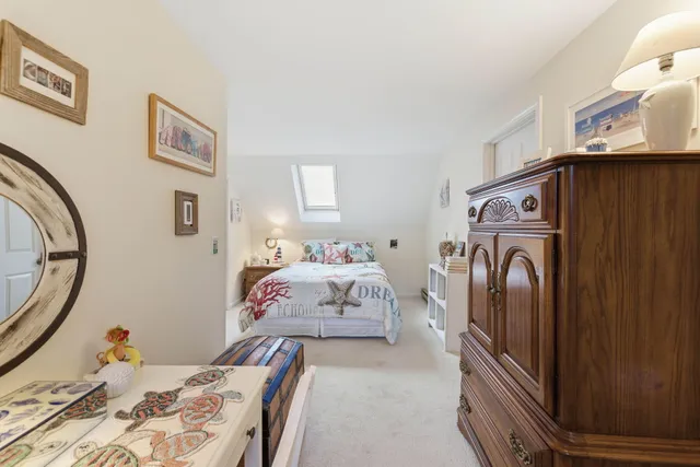 a bedroom with a bed and a mirror