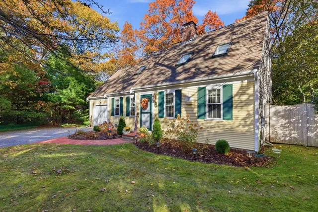 a view of a house with a yard porch and sitting area