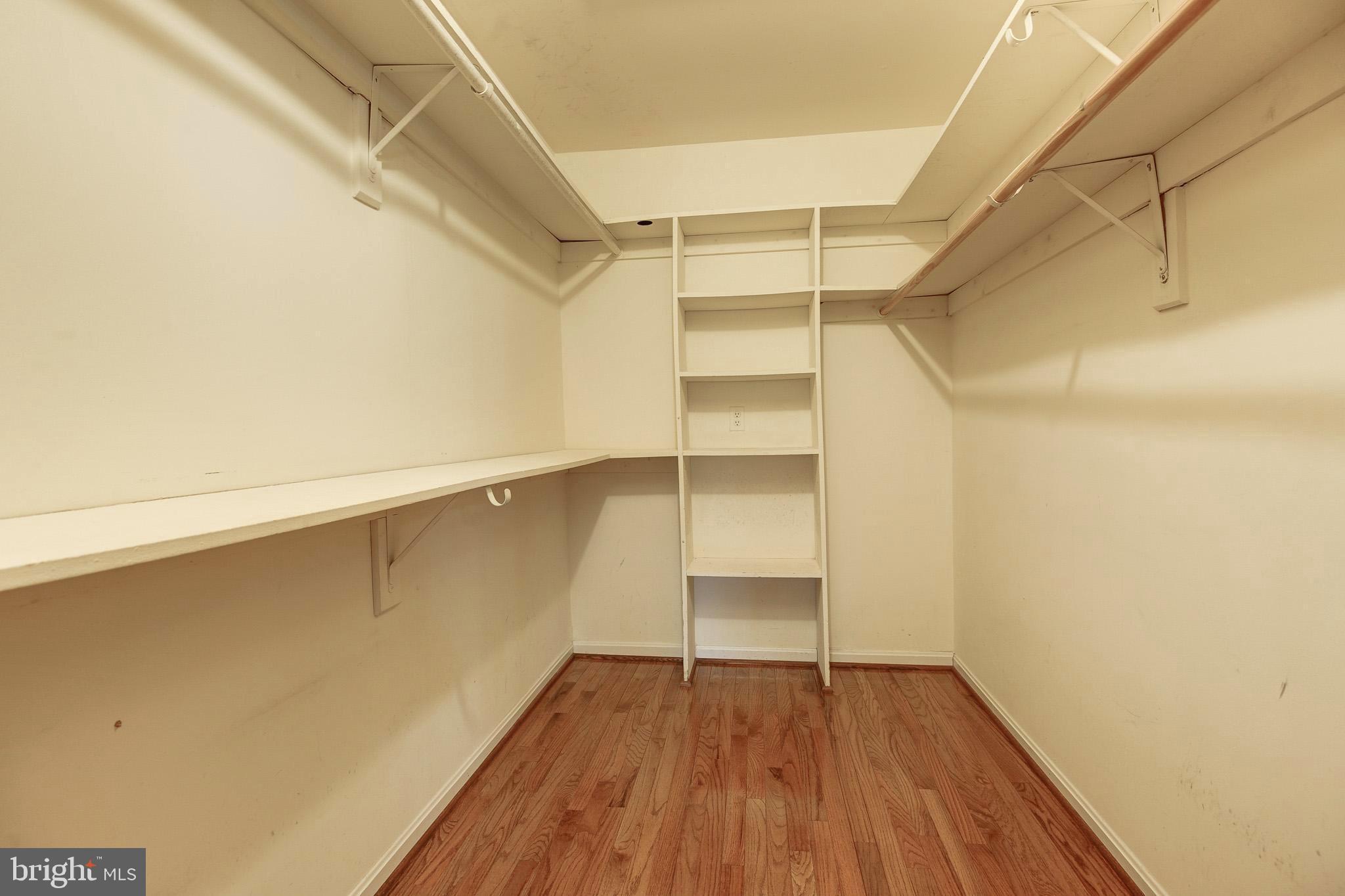 6814 Braddock Road Annandale, VA 22003 - Photo 26 of 68 a view of walk in closet with empty racks