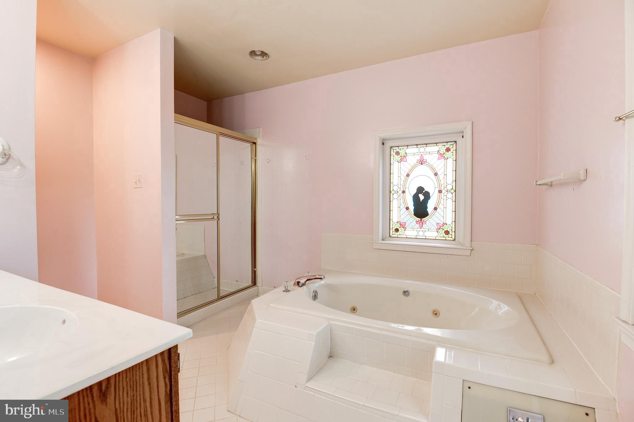 6814 Braddock Road Annandale, VA 22003 - Photo 27 of 68 a bathroom with a bathtub and a shower