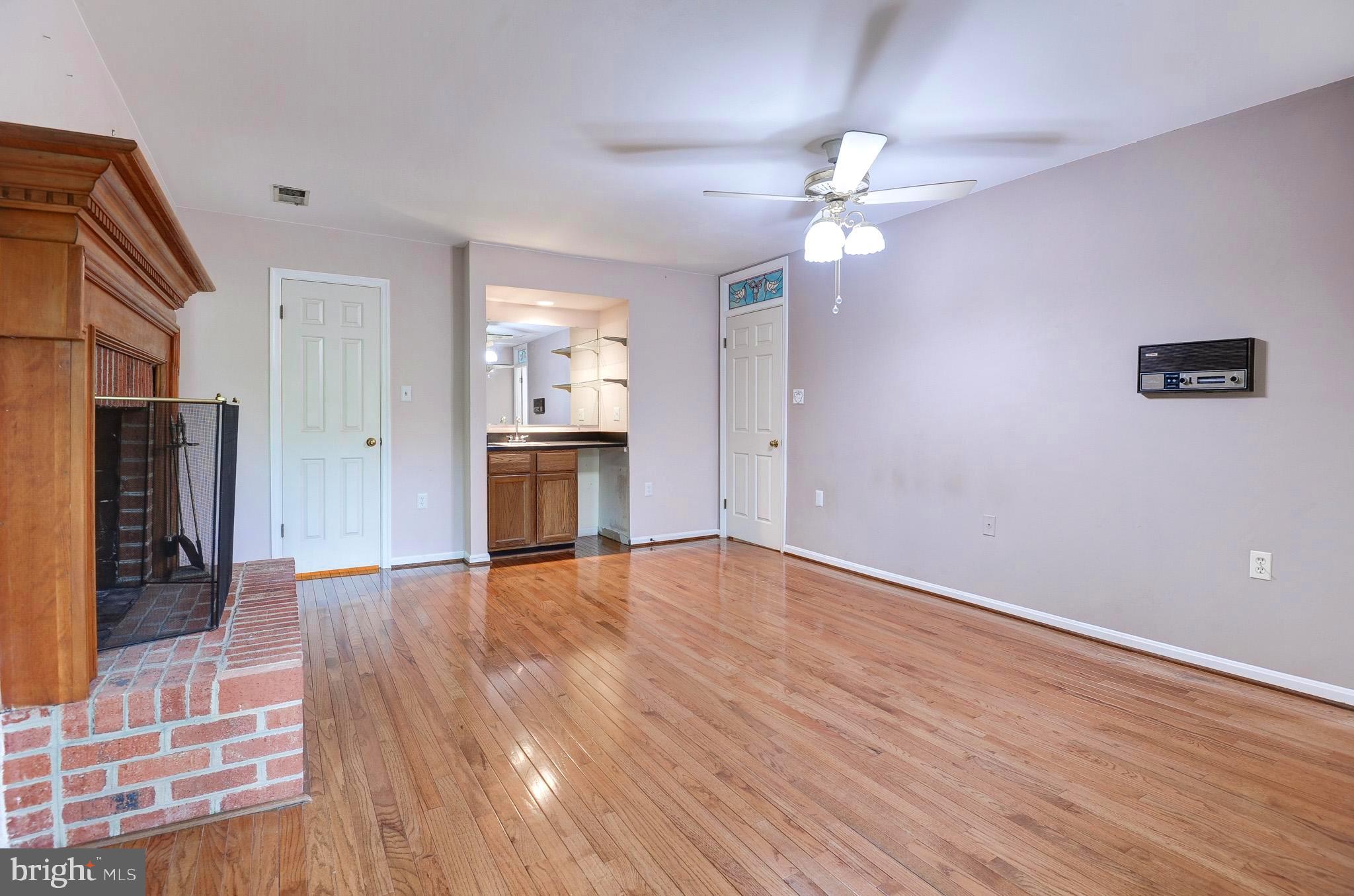 6814 Braddock Road Annandale, VA 22003 - Photo 28 of 68 a view of empty room with wooden floor and fireplace