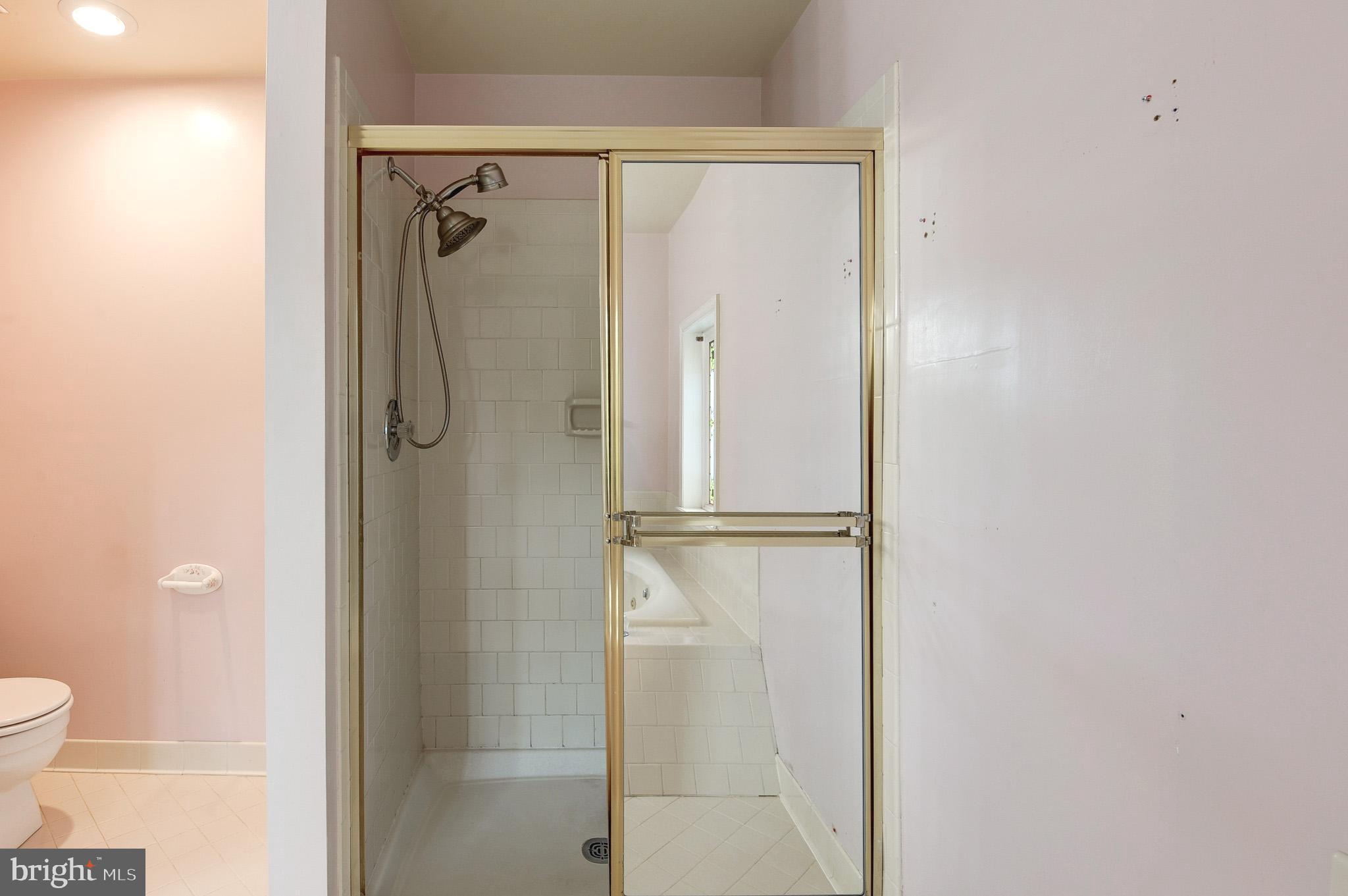 6814 Braddock Road Annandale, VA 22003 - Photo 31 of 68 a bathroom with a shower and a toilet