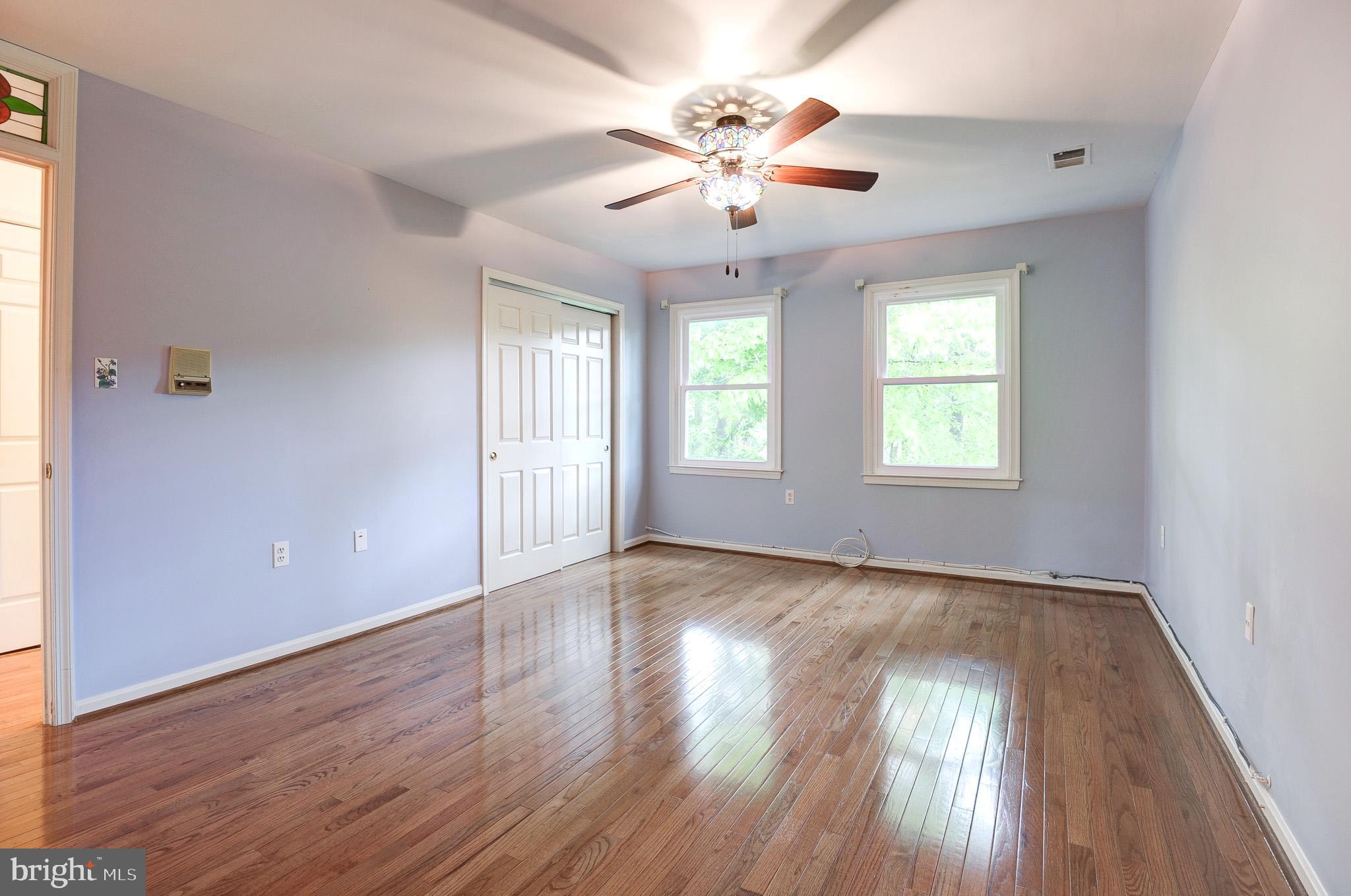 6814 Braddock Road Annandale, VA 22003 - Photo 32 of 68 a view of an empty room with wooden floor and a window