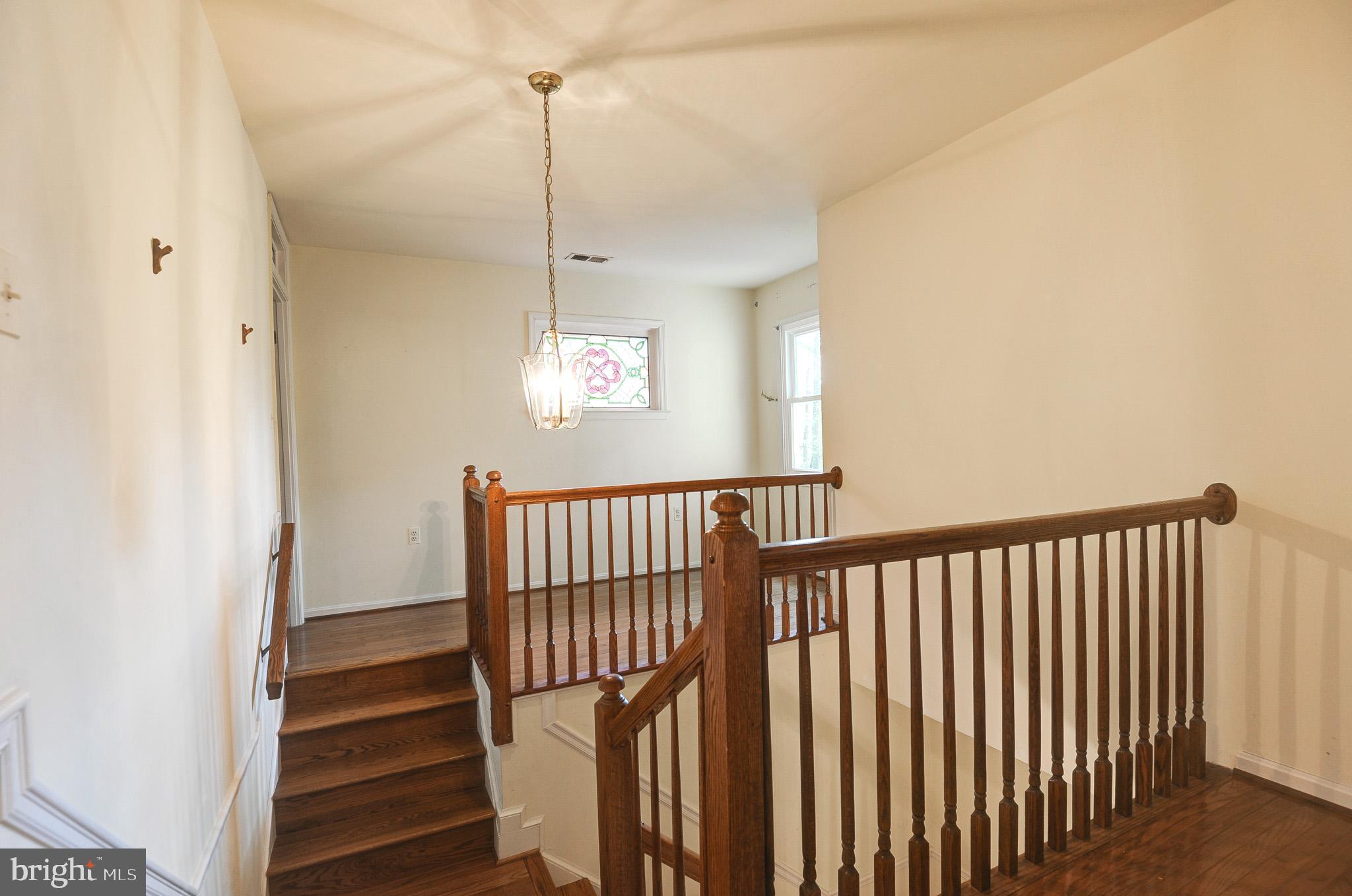 6814 Braddock Road Annandale, VA 22003 - Photo 37 of 68 a view of a hallway with stairs
