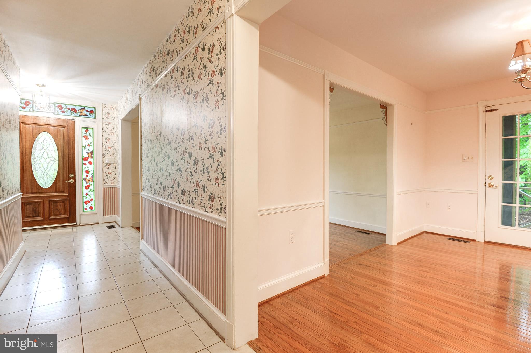6814 Braddock Road Annandale, VA 22003 - Photo 4 of 68 a view of a entryway door with wooden floor