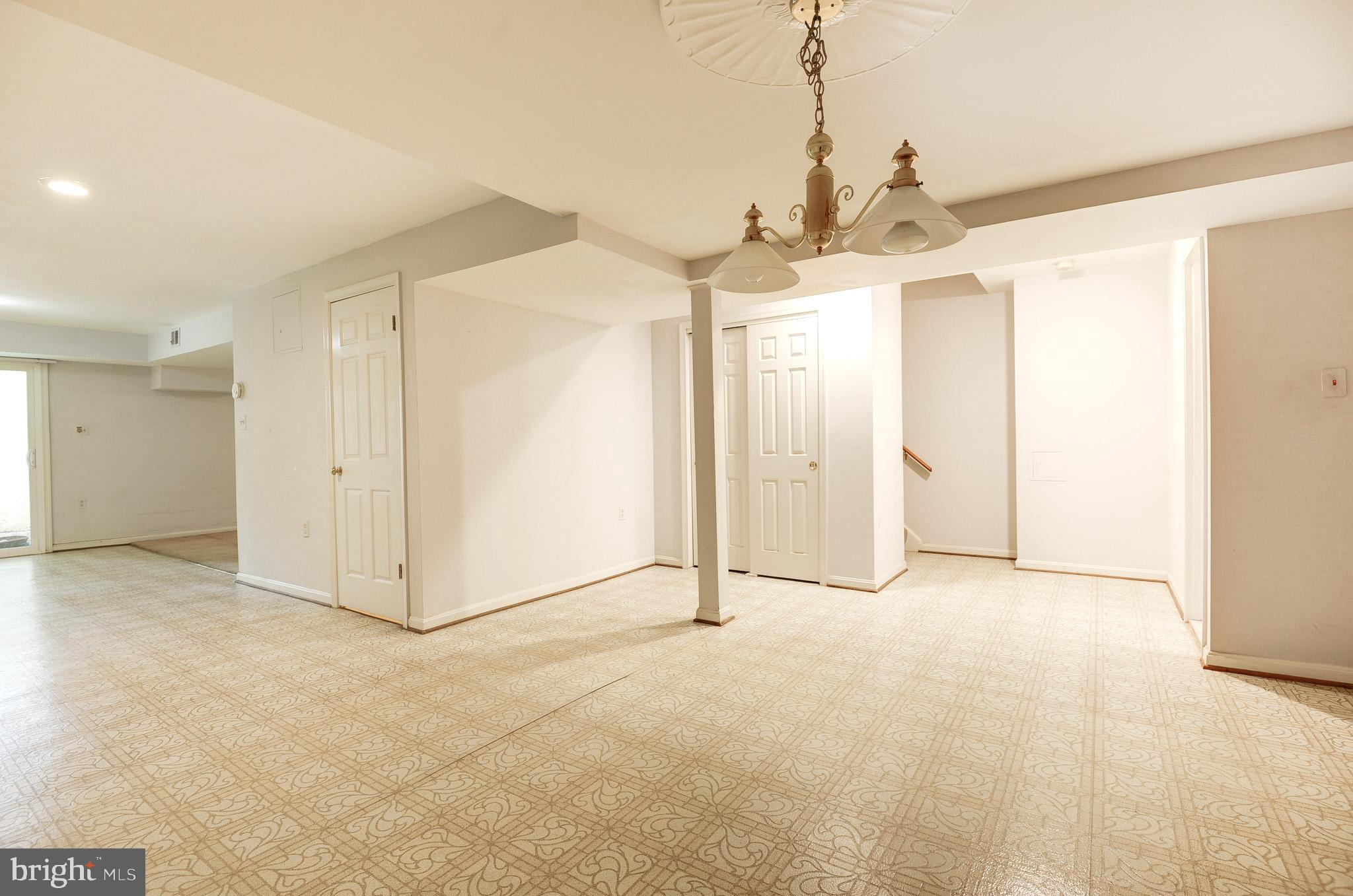 6814 Braddock Road Annandale, VA 22003 - Photo 40 of 68 a view of a hallway with a chandelier