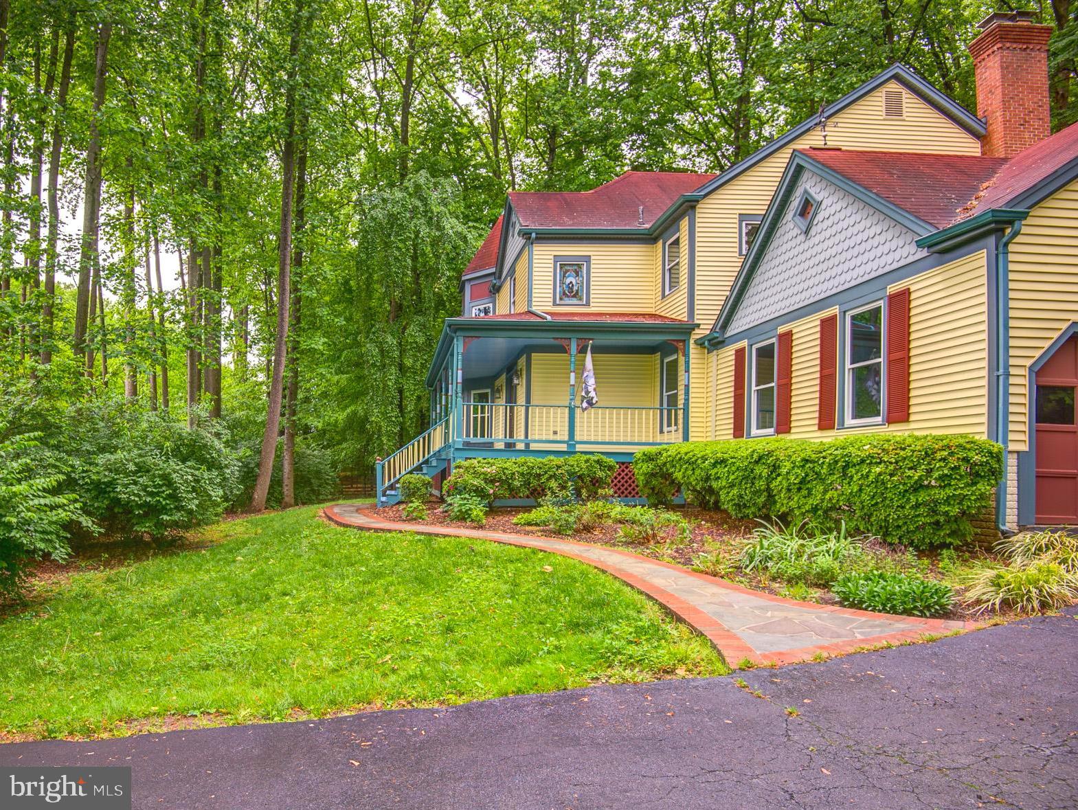 6814 Braddock Road Annandale, VA 22003 - Photo 52 of 68 a front view of a house with a yard