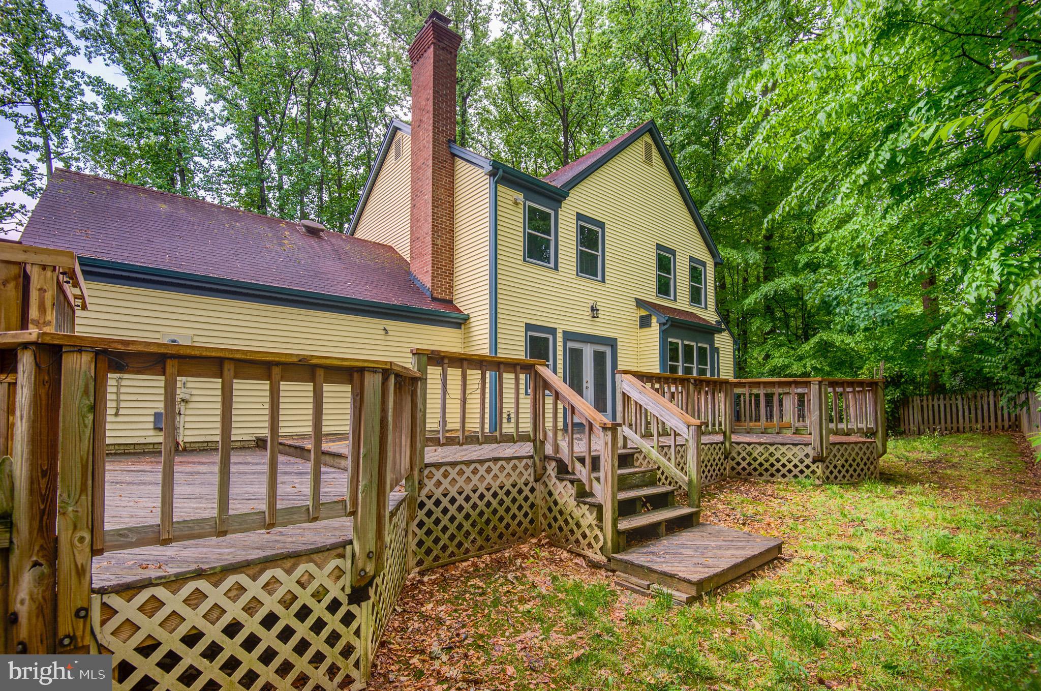6814 Braddock Road Annandale, VA 22003 - Photo 61 of 68 a view of a house with a yard from a patio