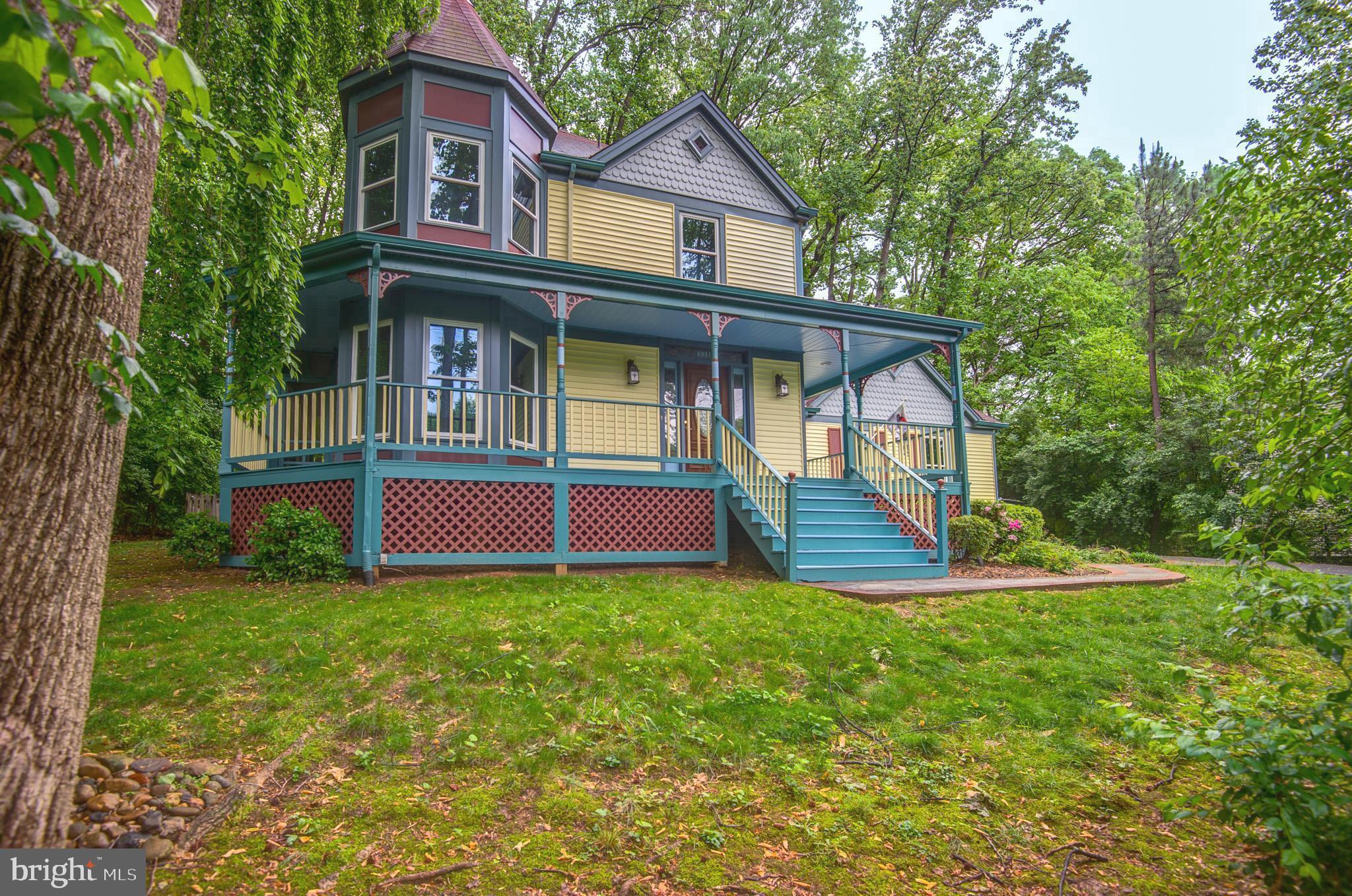 6814 Braddock Road Annandale, VA 22003 - Photo 63 of 68 a view of a house with a yard potted plants and large tree