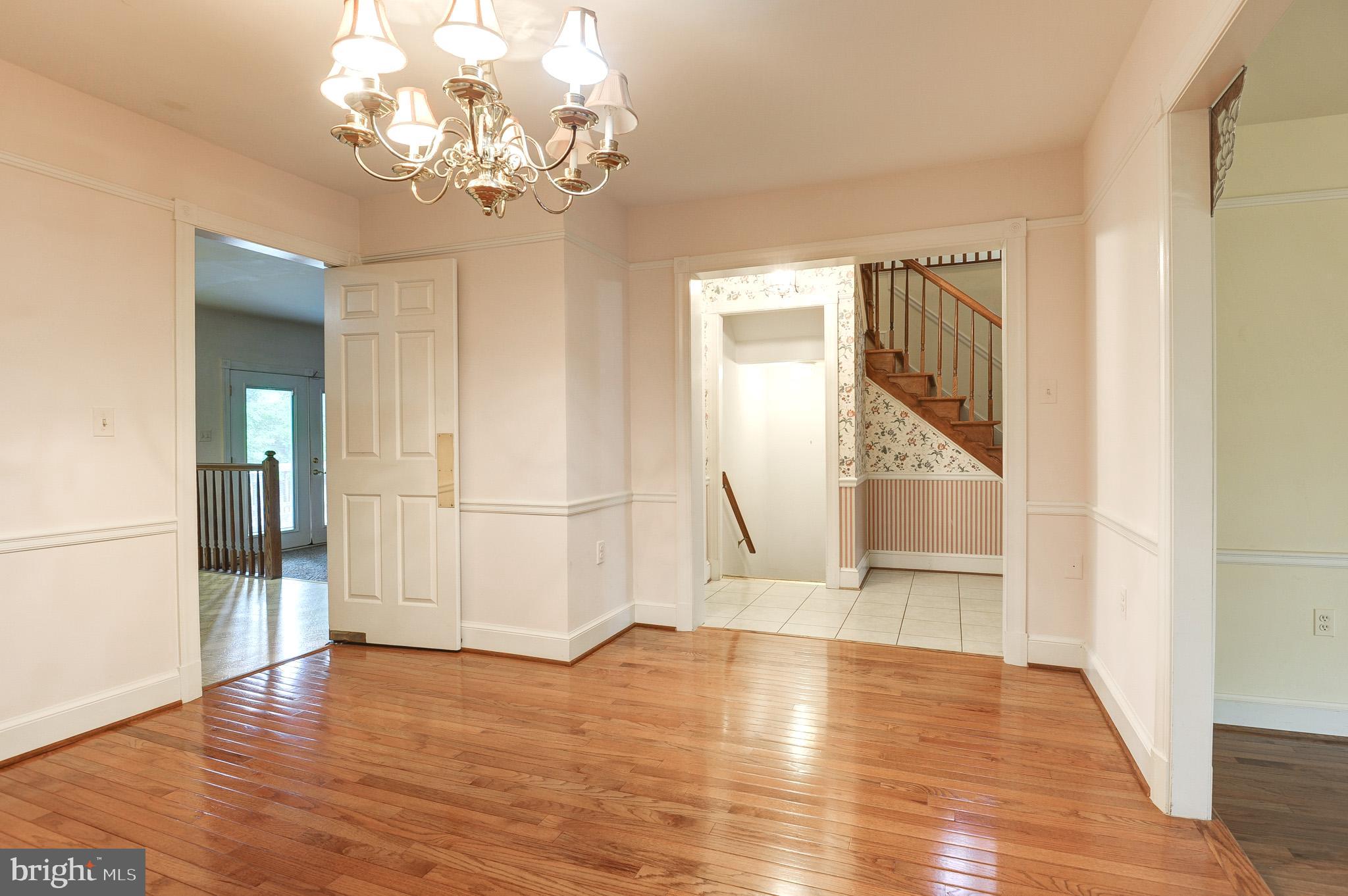 6814 Braddock Road Annandale, VA 22003 - Photo 9 of 68 a view of an empty room with wooden floor and a window