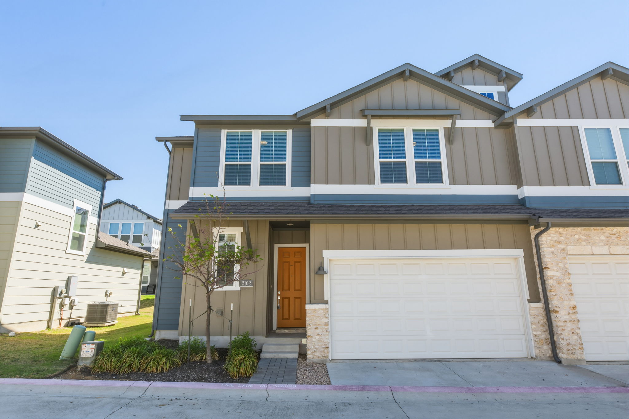 1015 Vista View Drive, Unit 2102 Georgetown, TX 78626 - Photo 1 of 40 a front view of a house with a yard and garage