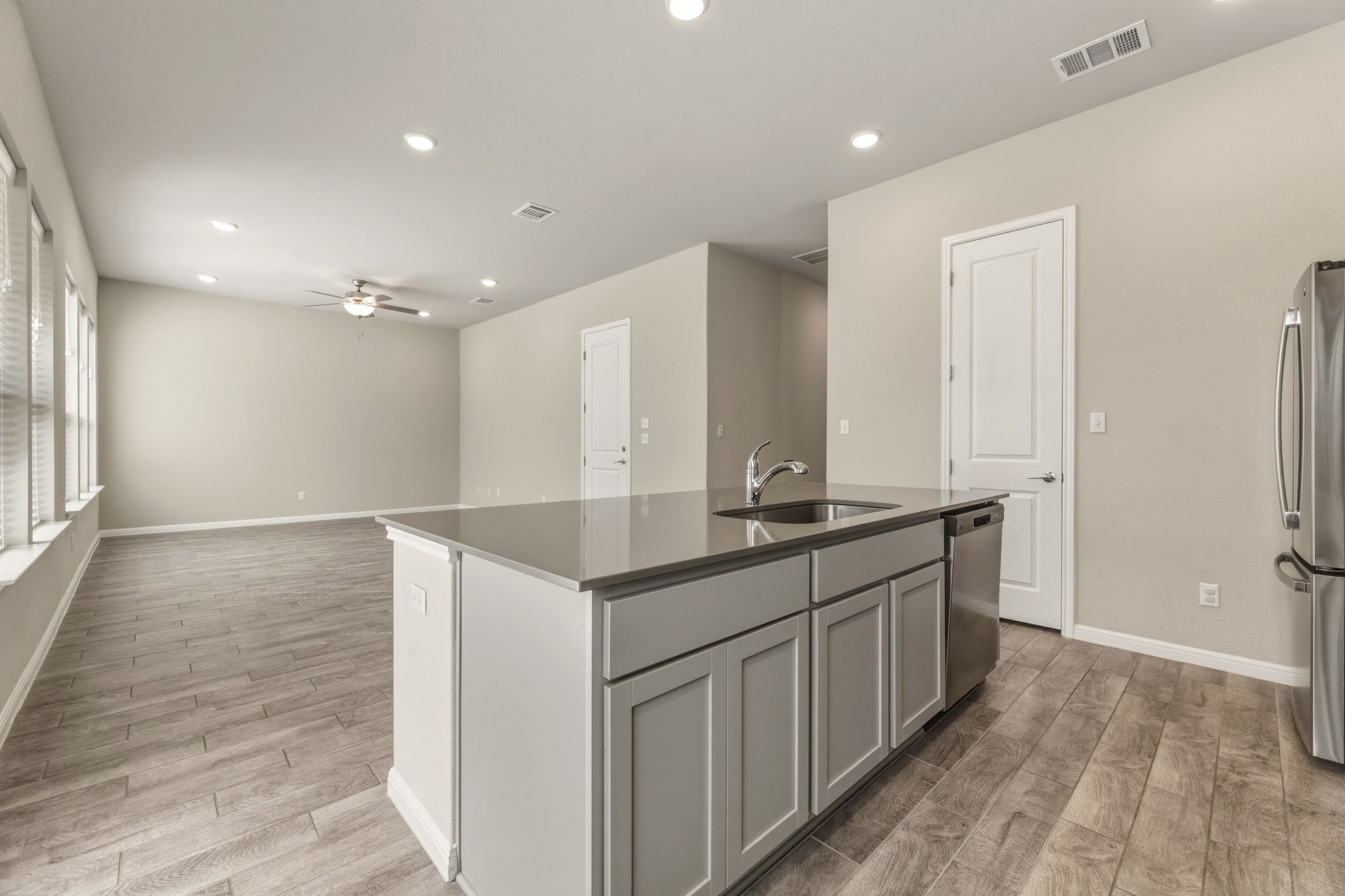 1015 Vista View Drive, Unit 2102 Georgetown, TX 78626 - Photo 39 of 40 a kitchen with center island and wooden floor