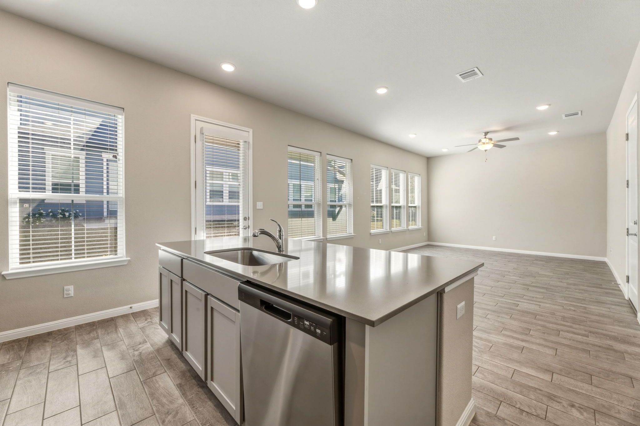 1015 Vista View Drive, Unit 2102 Georgetown, TX 78626 - Photo 40 of 40 a kitchen with granite countertop a stove and a sink