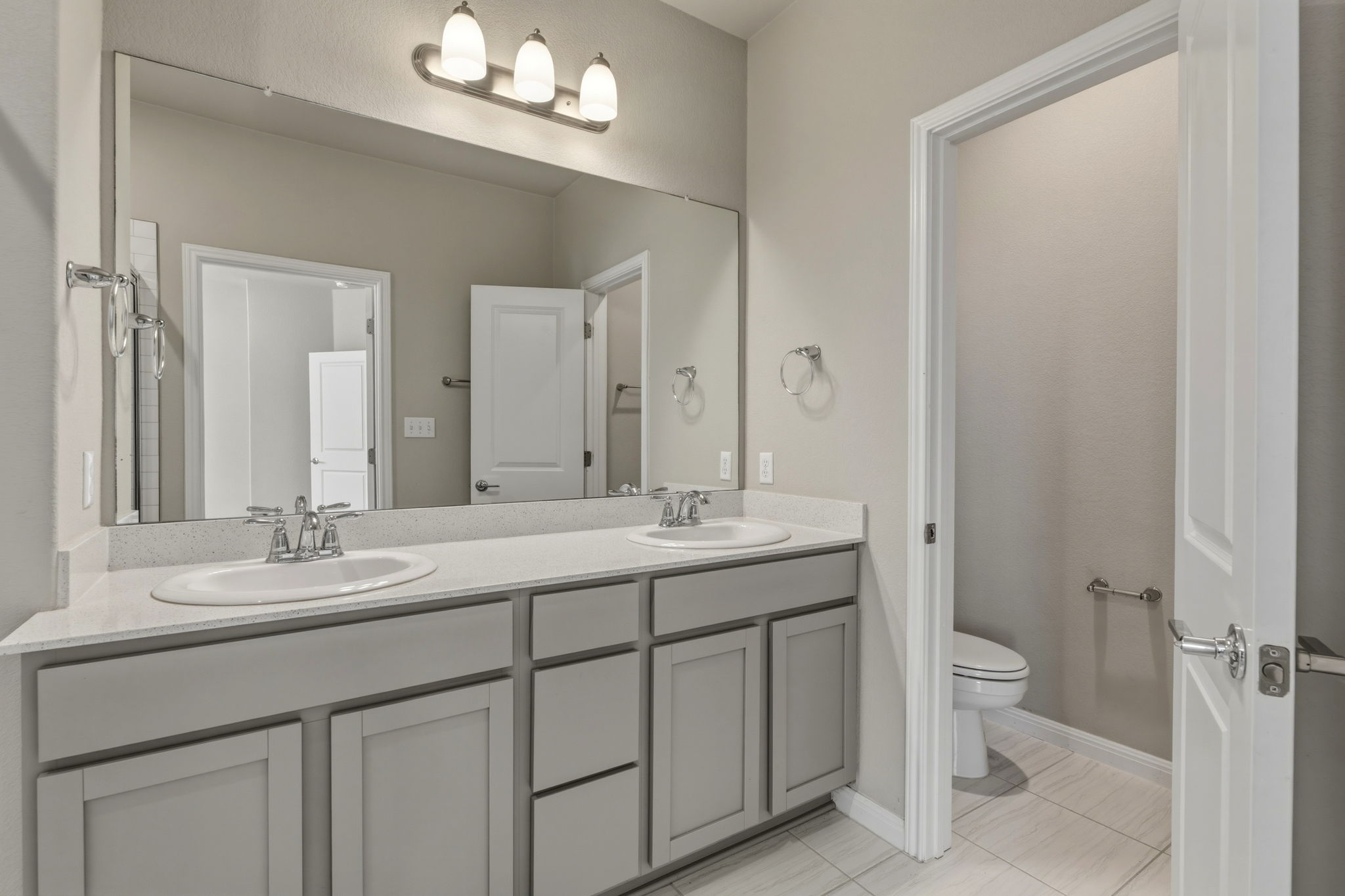 1015 Vista View Drive, Unit 2102 Georgetown, TX 78626 - Photo 22 of 40 a bathroom with a granite countertop sink a toilet and a mirror