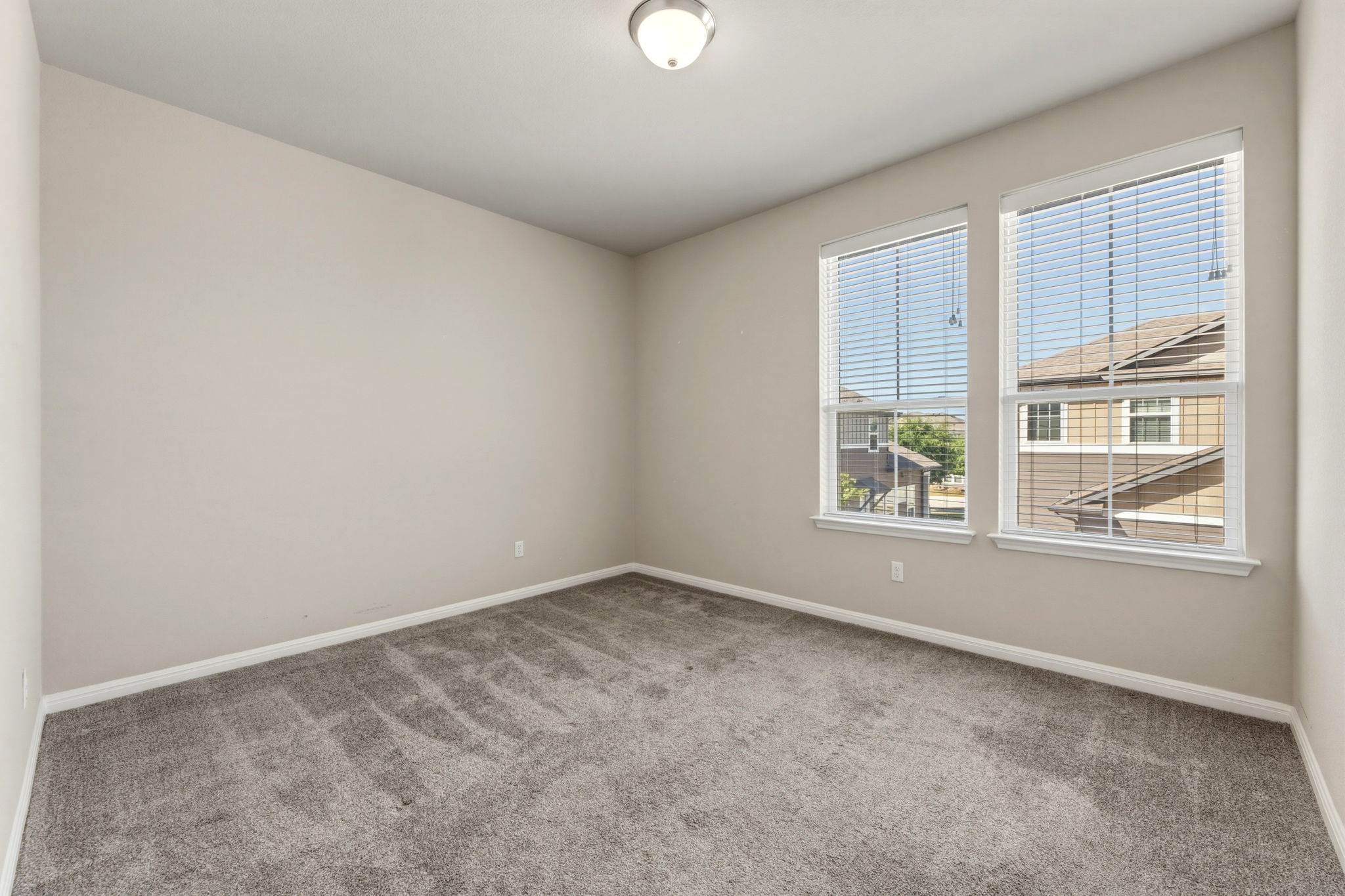 1015 Vista View Drive, Unit 2102 Georgetown, TX 78626 - Photo 30 of 40 an empty room with windows and closet
