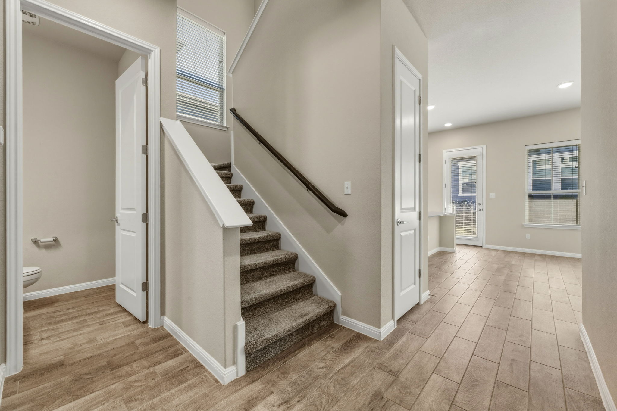 1015 Vista View Drive, Unit 2102 Georgetown, TX 78626 - Photo 7 of 40 a view of a hallway with wooden floor and staircase