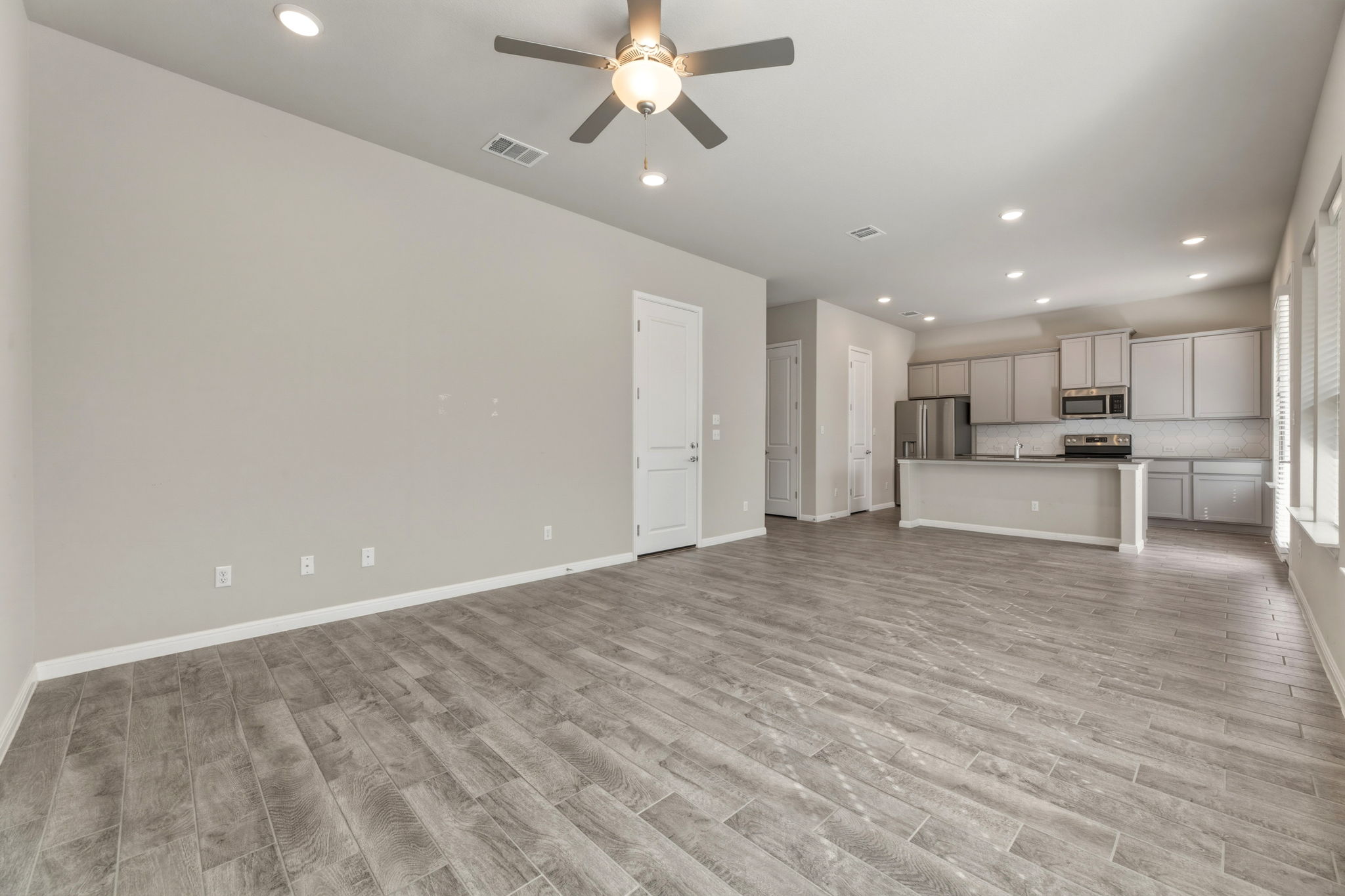 1015 Vista View Drive, Unit 2102 Georgetown, TX 78626 - Photo 9 of 40 a view of large kitchen with a sink stainless steel appliances and cabinets