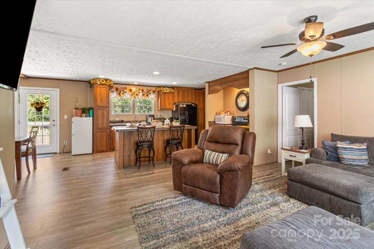132 Bailey Mountain Road Mars Hill, NC 28754 - Photo 13 of 33 a living room with furniture and wooden floor