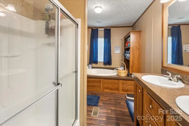 a bathroom with a double vanity sink and a mirror